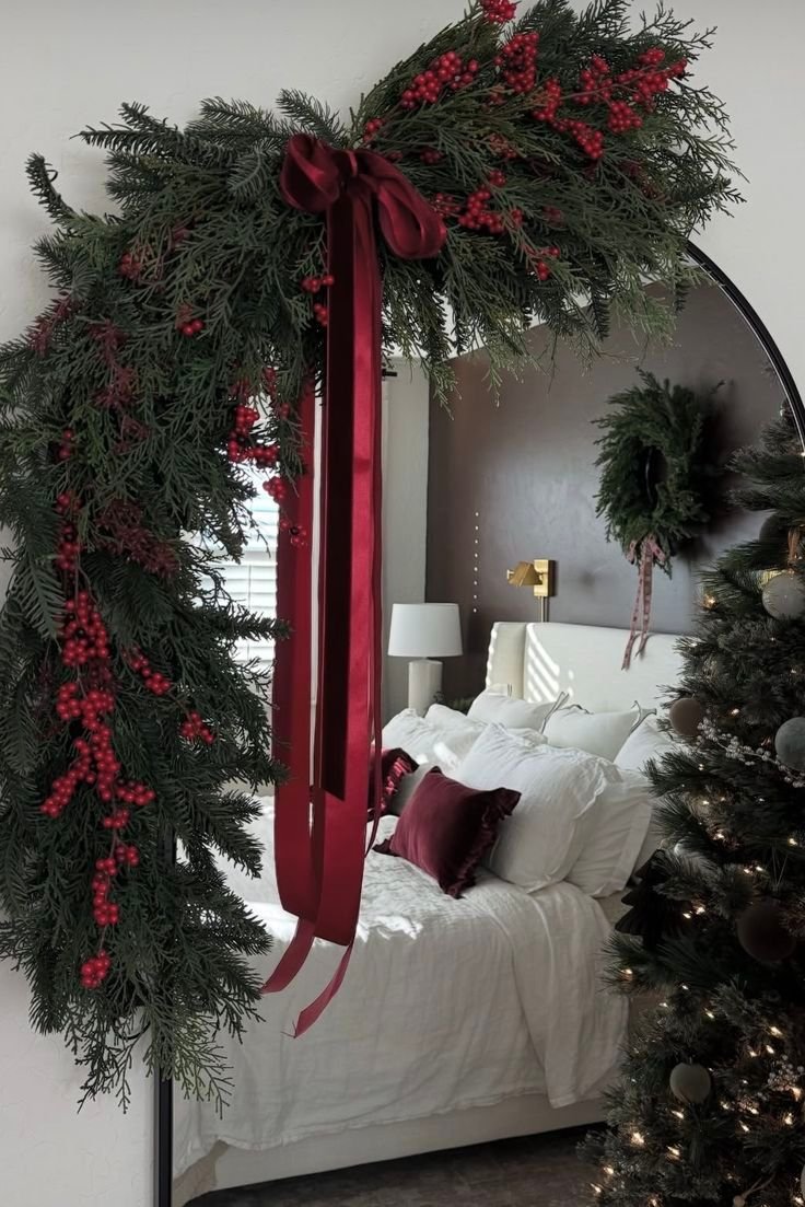 Small wreath hung over a bedroom mirror as a Christmas accent