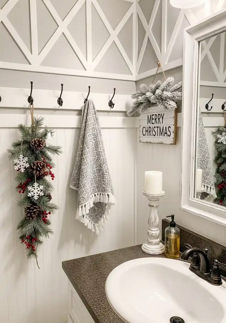 Wall mounted coat hooks with a hanging Christmas greenery swag