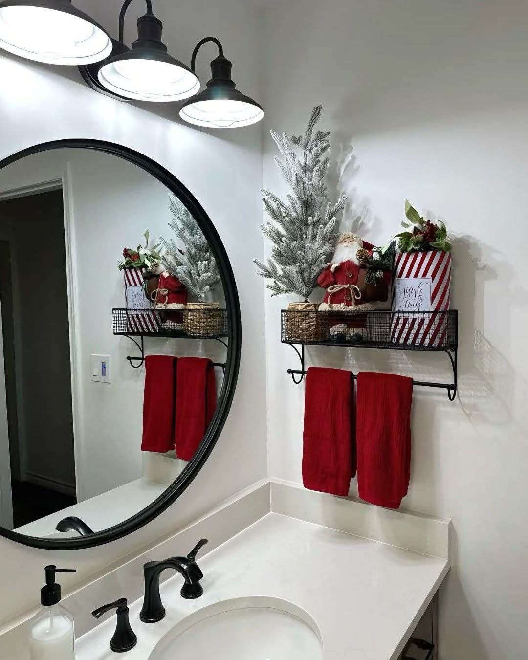Floating bathroom shelf with a vintage Santa figurine and folded red towels