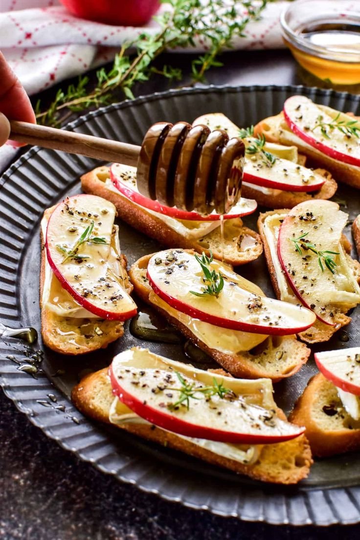Brie and apple crostini drizzled with honey and fresh thyme