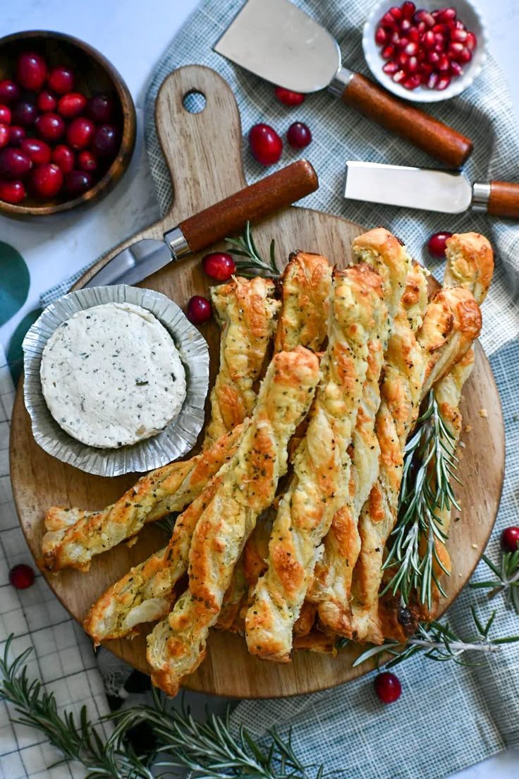 Parmesan puff pastry twists served with herbed cheese and fresh cranberries