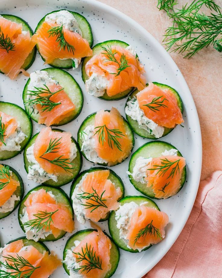 Smoked salmon and cream cheese cucumber bites garnished with dill