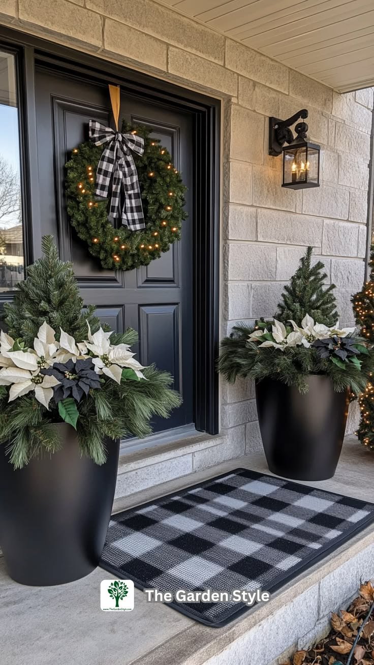 Matte black Christmas planter with white poinsettias below a buffalo check wreath