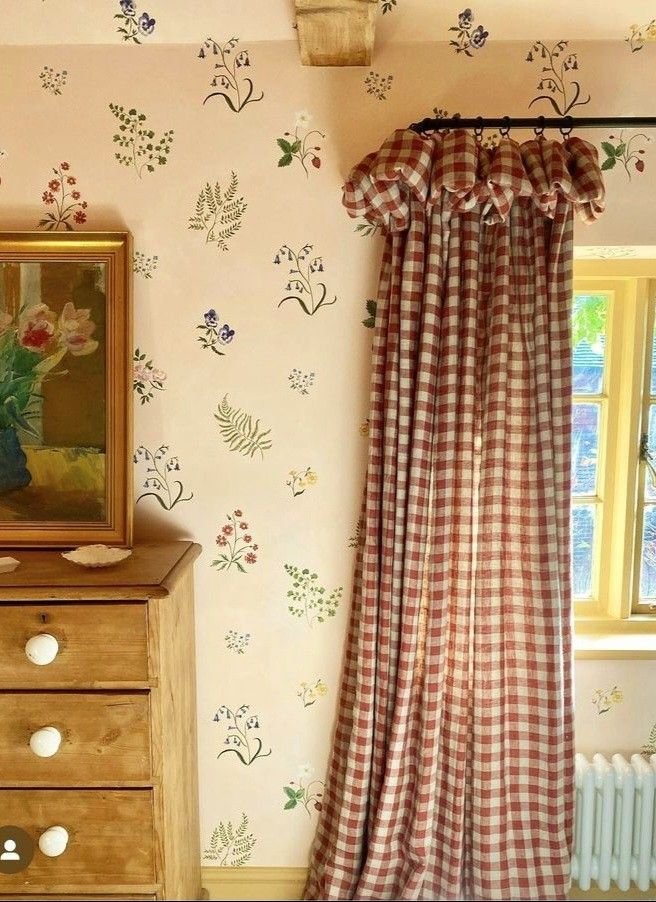 Red gingham curtains in a cozy cottagecore bedroom window