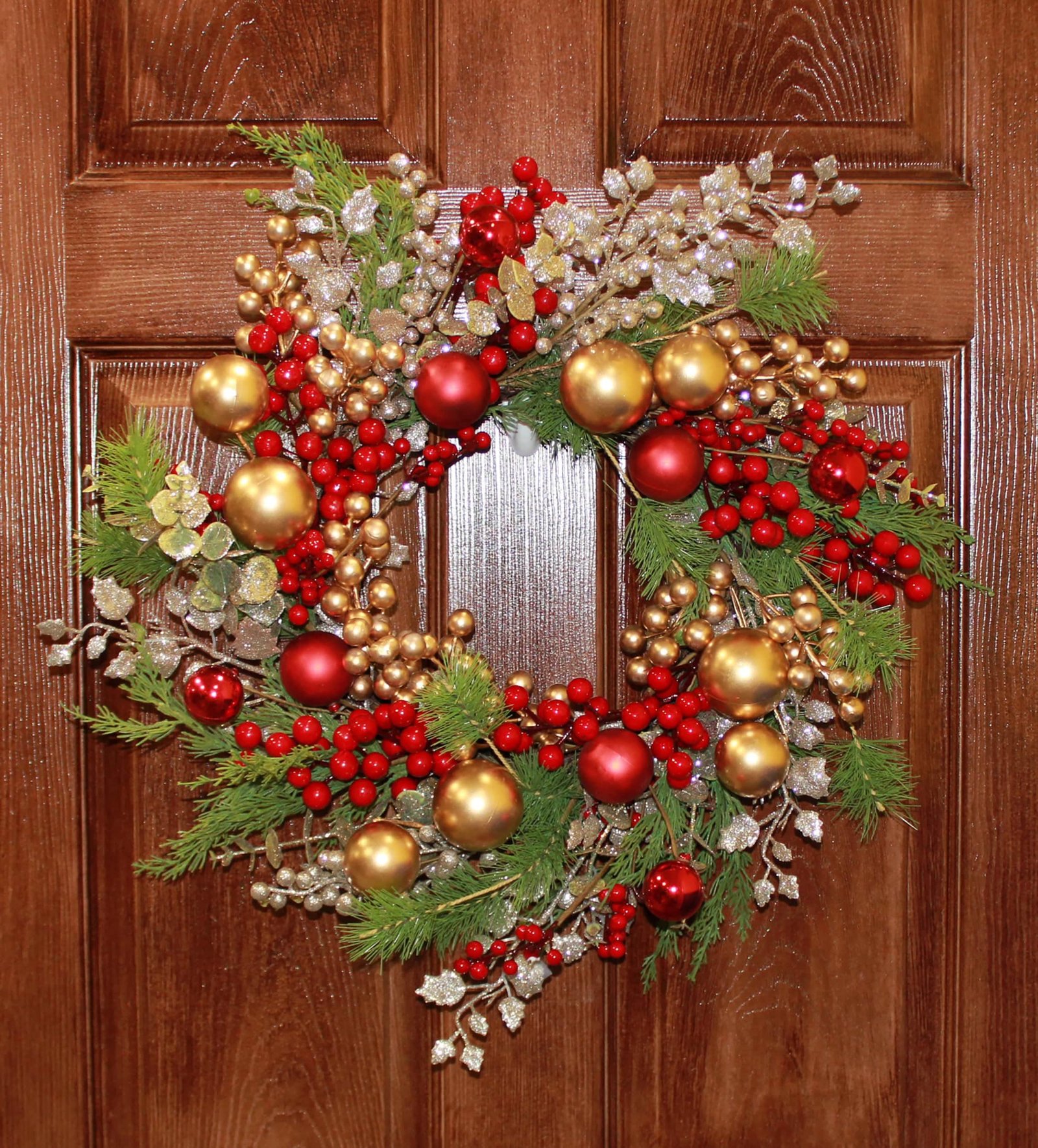 Red and gold ornament wreath with eucalyptus and cedar greenery
