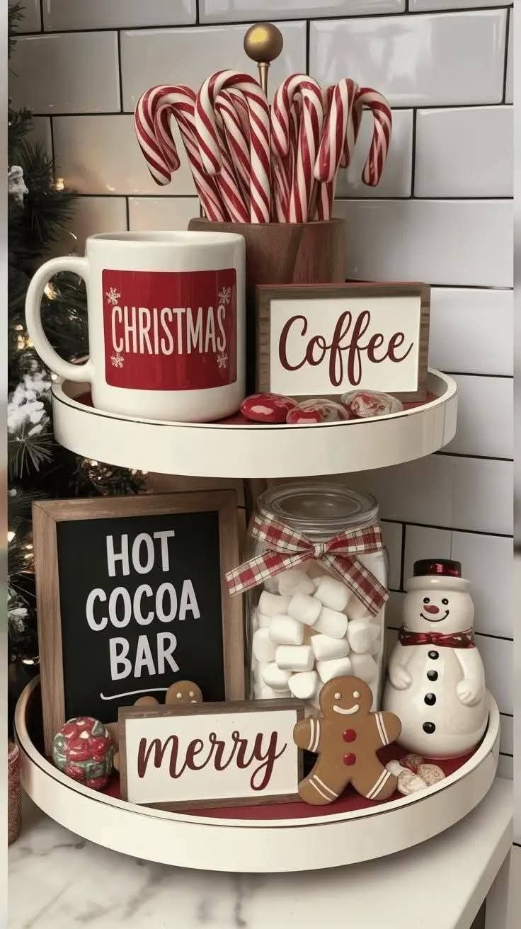 A small tiered tray styled as a hot cocoa bar with a mug and coffee sign