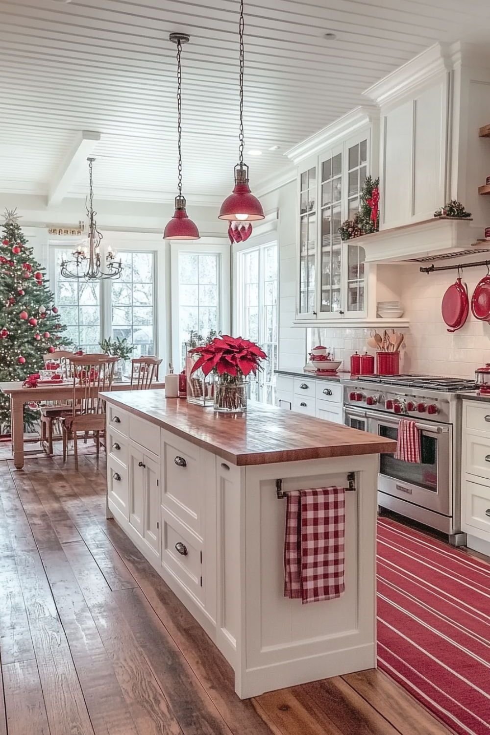 A long red and white garland with ribbon bows draped along a kitchen island
