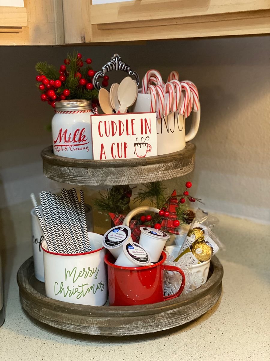 Tiered coffee station tray with a Cuddle in a Cup sign, milk jar, and candy canes