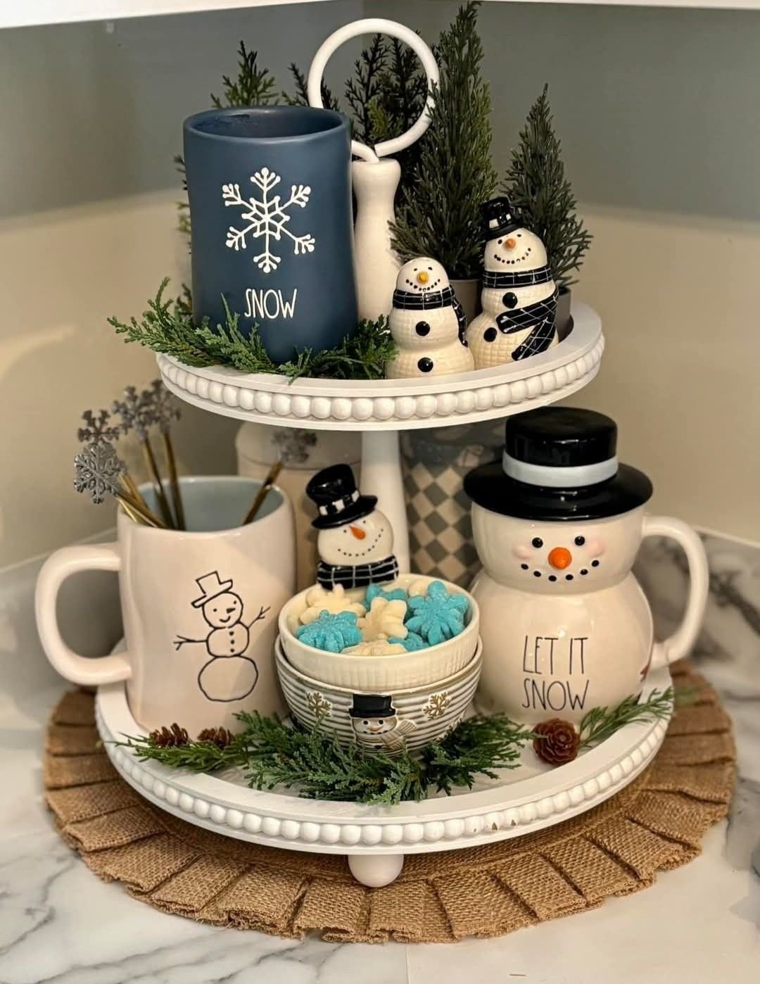 Tiered tray with a blue Snow mug and ceramic snowman salt and pepper shakers