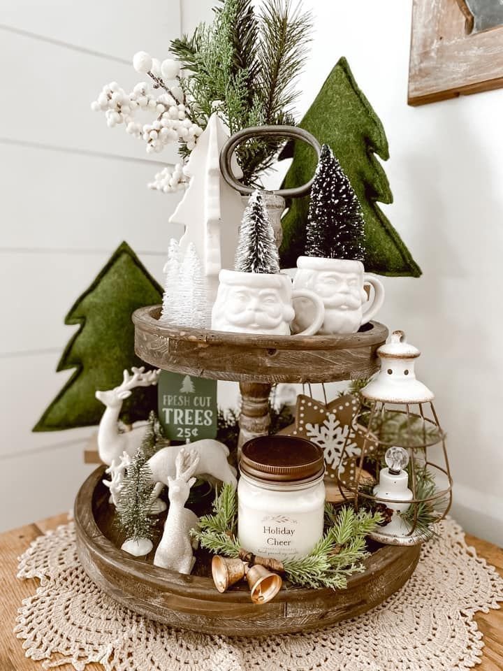 Tiered tray with a Fresh Cut Trees sign and Santa face mugs