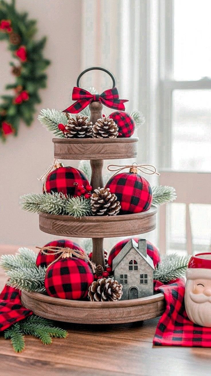 Tiered tray with buffalo plaid fuzzy booties and a Snowplace Like Home sign
