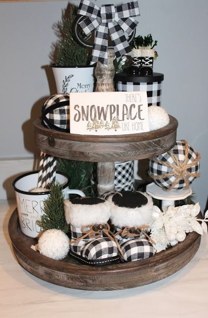 Tiered tray with an Oh Holy Night sign and a buffalo plaid gift box