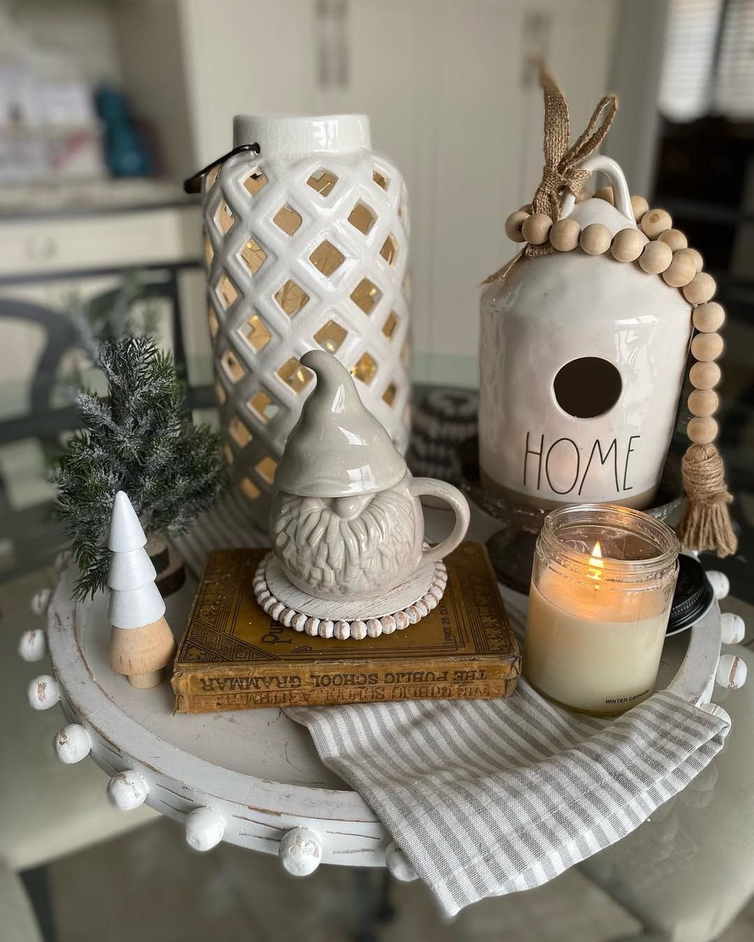 Tray with a white ceramic lantern and a gnome mug
